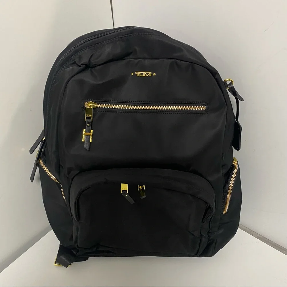 Tumi Black Backpack with Gold Zippers